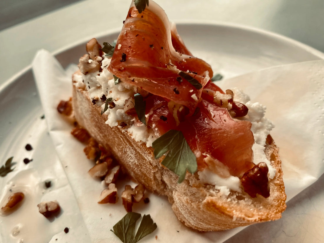 Honey Goat’s Cheese Crostini with Prosciutto and Walnuts